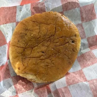 Bun looks like it was placed on a grill needing some cleaning