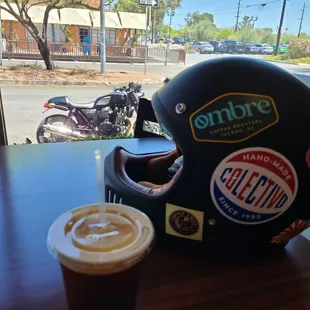 a helmet and a cup of coffee