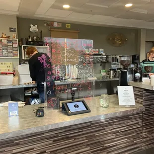 a woman standing at the counter
