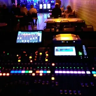 a dj's desk in a dimly lit room