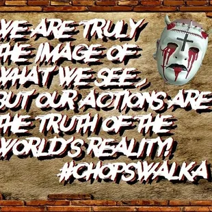 a mask on a brick wall