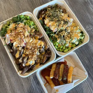Chicken and spicy pork on purple rice with a bunch of different veggies, spicy mayo and creamy garlic sauce; and the Sotteok skewers.