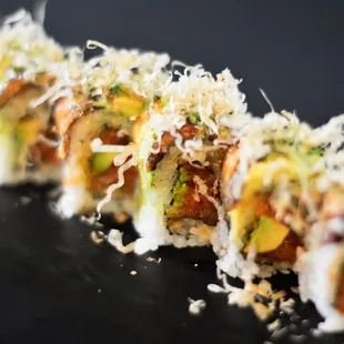 Heart of Fire: Spicy tuna, avocado, baked eel, green onion, dried tuna flake, eel sauce