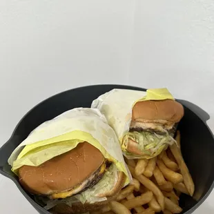 Giant charbroiled burgers that had grill lines. Double cheeseburgers combo with small fries.