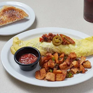an omelet, potatoes, and toast