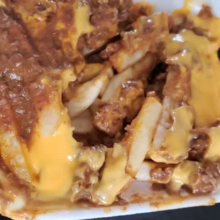 a plate of cheese fries