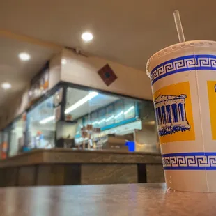 a drink in a paper cup