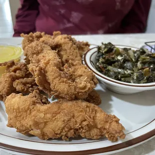 Fresh fried chicken tenders with collard greens