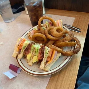 Club Sandwich with Onion Rings.
