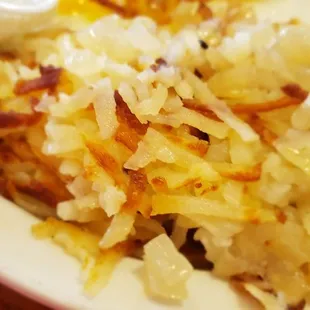  plate of hash browns with sour cream
