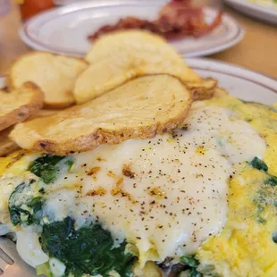 eggs, spinach, and potatoes on a plate