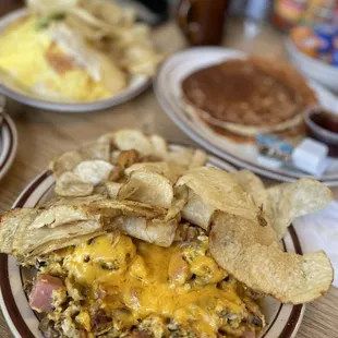 Scrambled eggs with ham, onions, mushroom and cheddar cheese