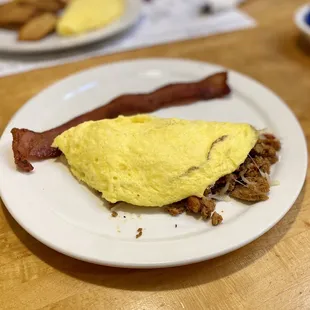 I already ate one piece, but this was the best bacon I&apos;ve ever had.  Stuffed omelette, too.