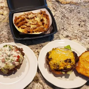 OMG Cheesburger and Guaca Burger with parmesan fries.