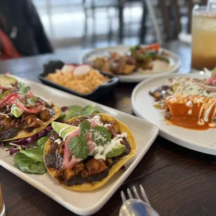 three plates of food on a table