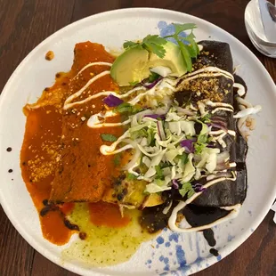 3 types of enchiladas red sauce on the left green in the middle and mole on the right overall 10/10 100% would recommend.
