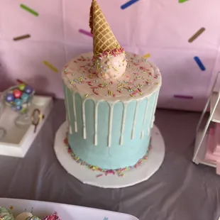 The baker was able to insert a foam to achieve this mega tall &quot;look&quot; for the cake design I wanted. Delicious and beautiful!