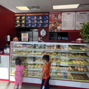 two children in front of the counter
