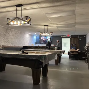 a pool table in the middle of the room