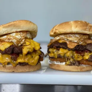 two cheeseburgers on a plate