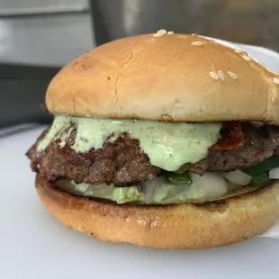 a hamburger with cheese and lettuce