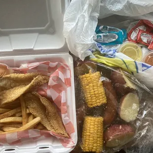 Fish plate (roll, 2 sides), double order of sausage bayou bag, lots of condiments provided w/o request. Feb 2023