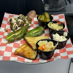 Falafel, Fried eggplant and cooked peppers and some amazing toppings( pickles, spicy salad,babaganush, etc)