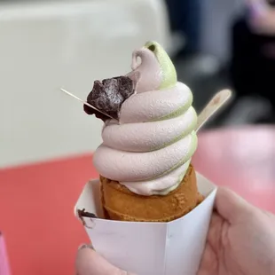 a person holding an ice cream cone