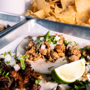 a close up of a taco and chips