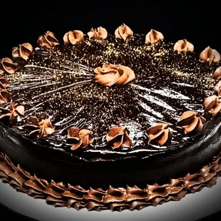 Triple Chocolate Mousse Cake, flourless Mousse Cake finished with 2 Ganaches.