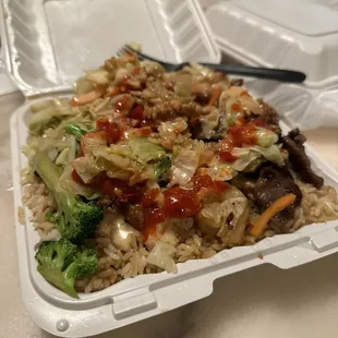 a close up of a take out container of food