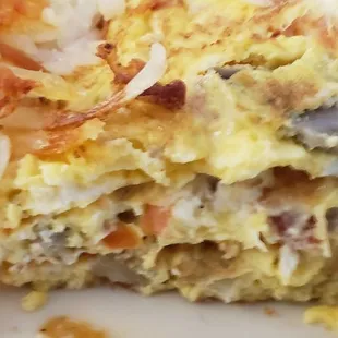 Inside the gyro and feta omelette with added tomato and onion.