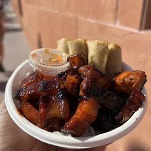 a person holding a plate of food