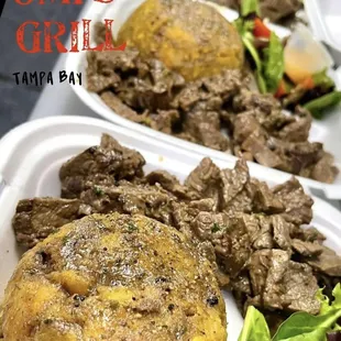 a close up of a meal in a styrofoam container