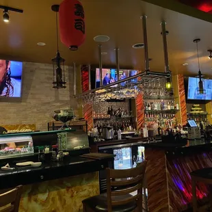 a bar with a large screen tv