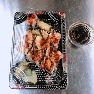 a plate of food and a glass of beer