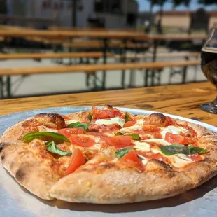 a pizza and a glass of beer