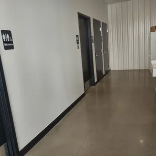 Four individual bathrooms. Not pictured on the right is the sinks