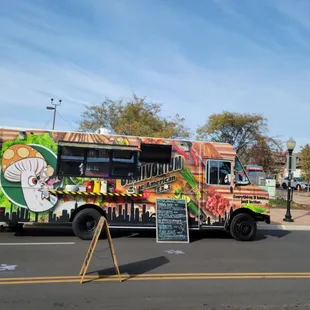 a food truck parked on the side of the road