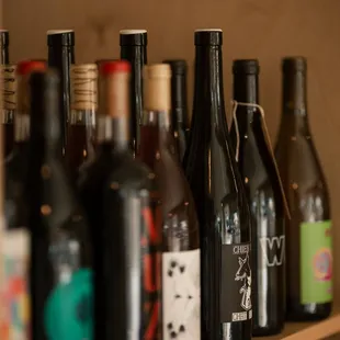a shelf full of wine bottles