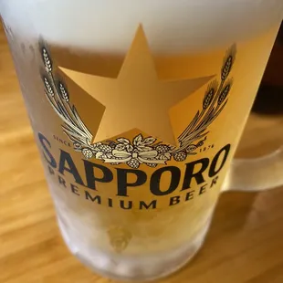a glass of sapporo beer