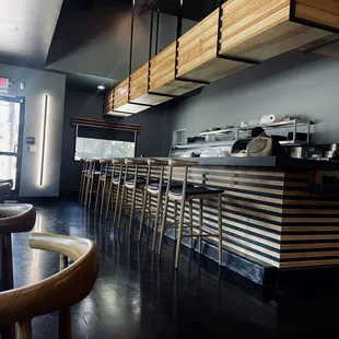 a restaurant with a long counter