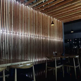 a restaurant with wooden walls