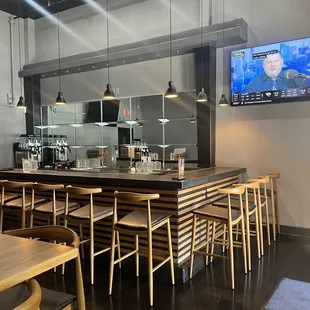 a restaurant with a large screen