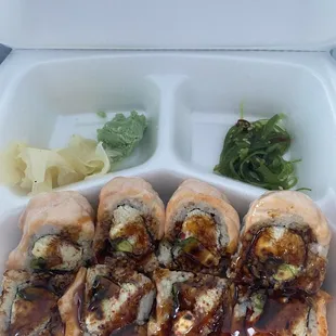 Princess Roll: Crab meat, cream cheese, avocado, and sweet radish, topped with salmon and baked then drizzled with eel sauce