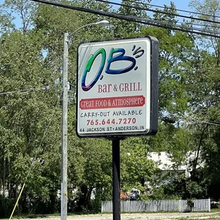 a sign for o b&apos;s grill and chill