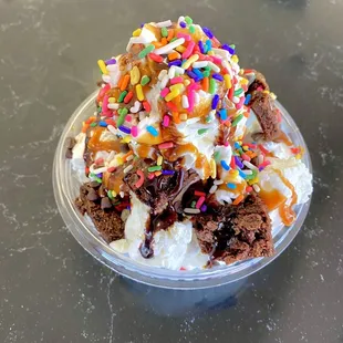 an ice cream sundae with sprinkles