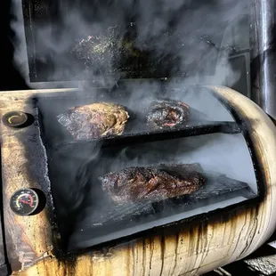 Meat smoking for an event in our handmade custom smoker