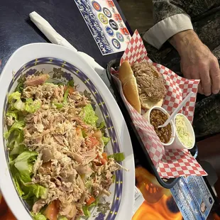 House salad with pulled chicken, pulled pork sandwich with two sides