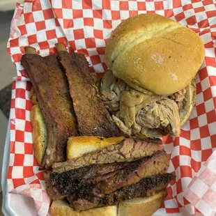 3 meat combo of ribs, brisket, and pulled pork sandwich with sweet potato fries &amp; baked beans $22 (instagram: @issa.cheatday)